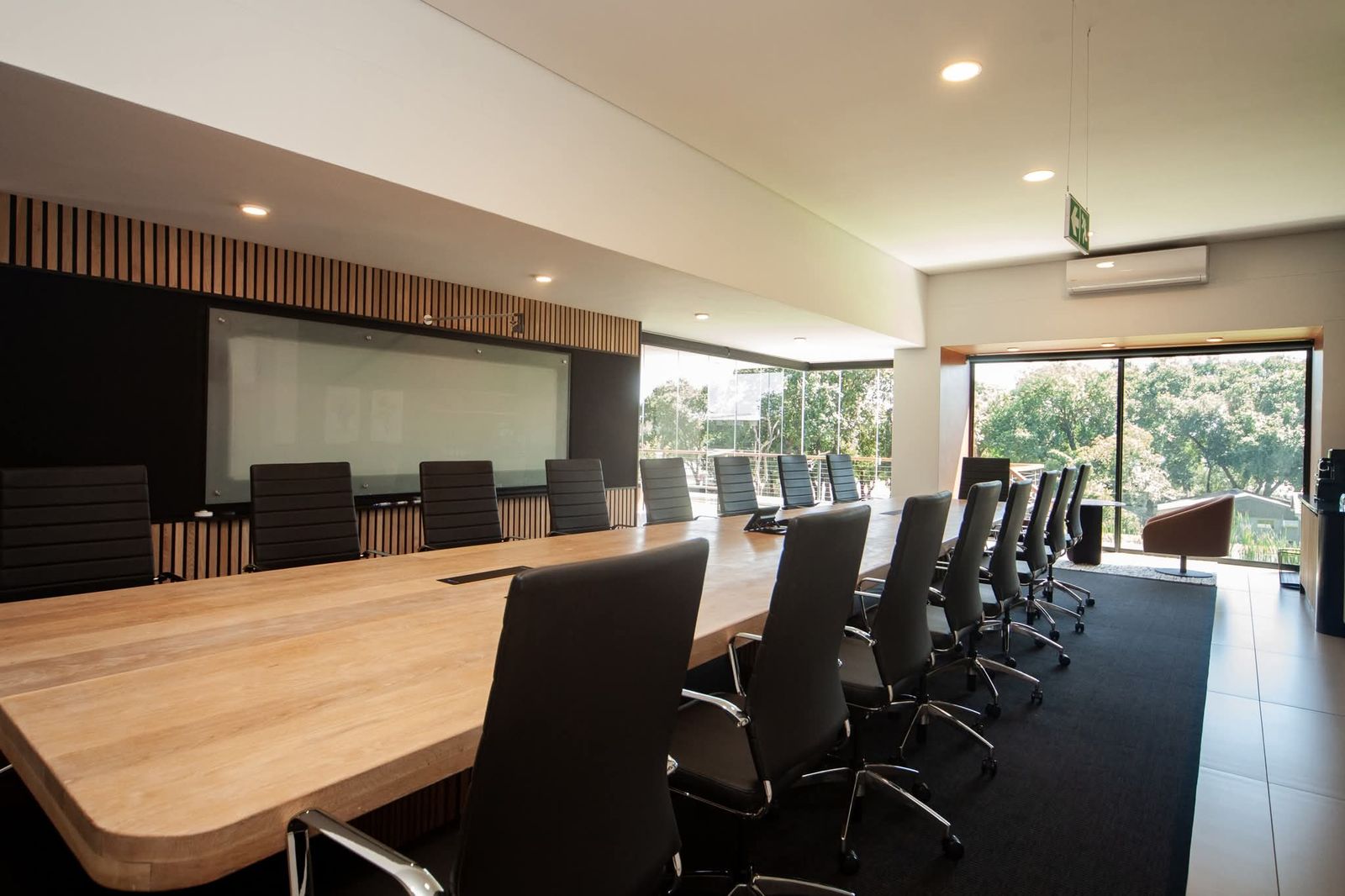 Boardroom with recessed downlights and a long table