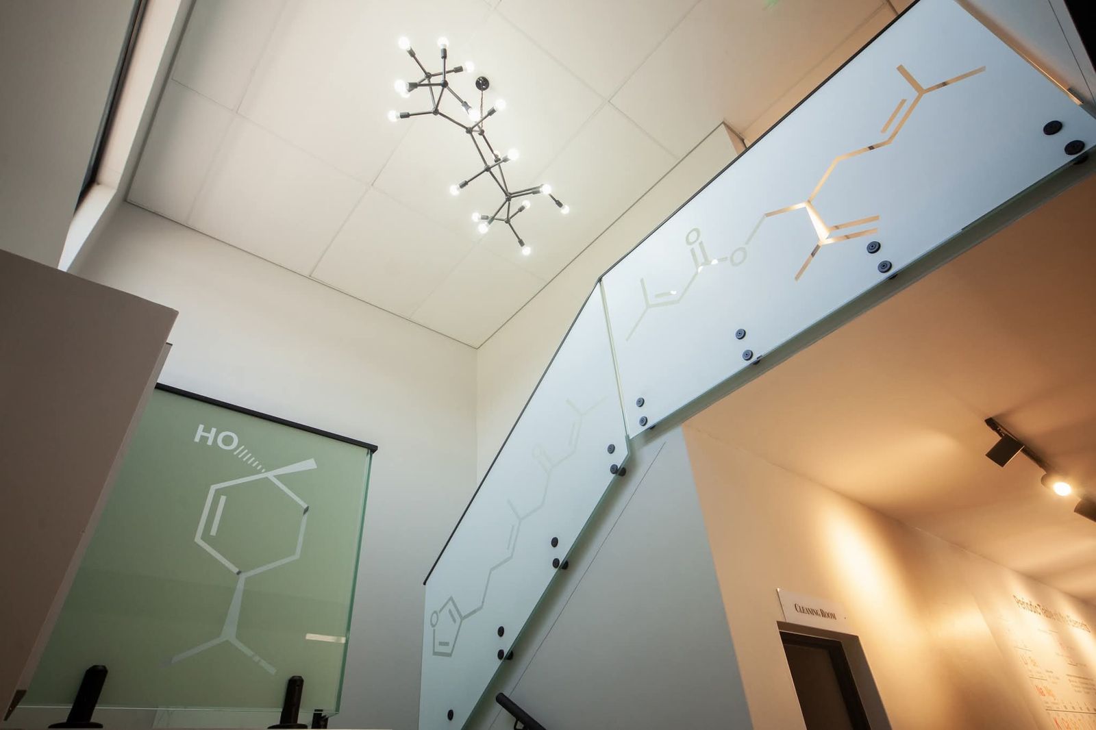 Stairwell with a molecule-shaped light fitting