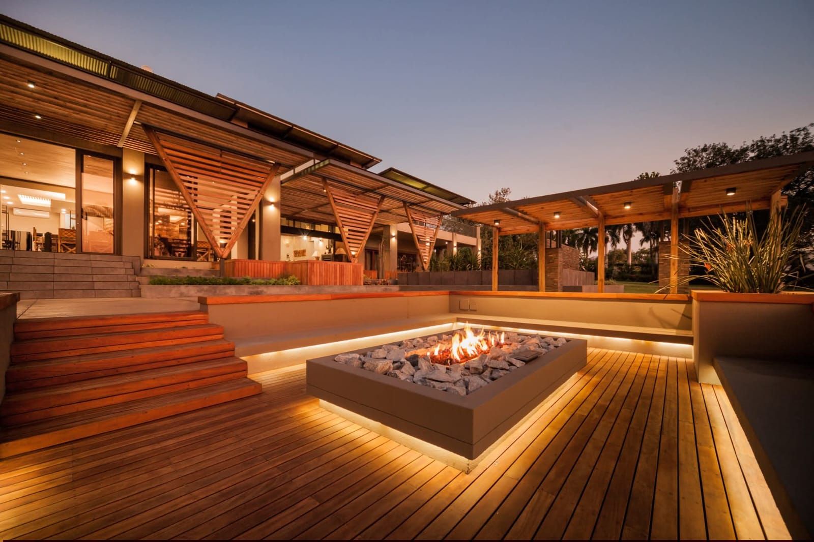 Timber deck with a sunken fire pit and LED strip lighting