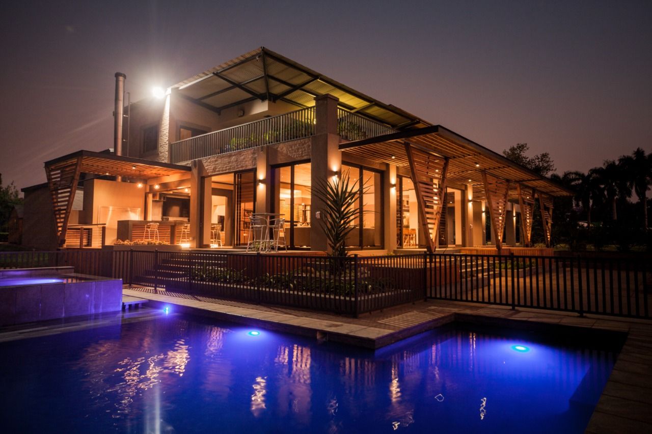 House at night with pool lighting