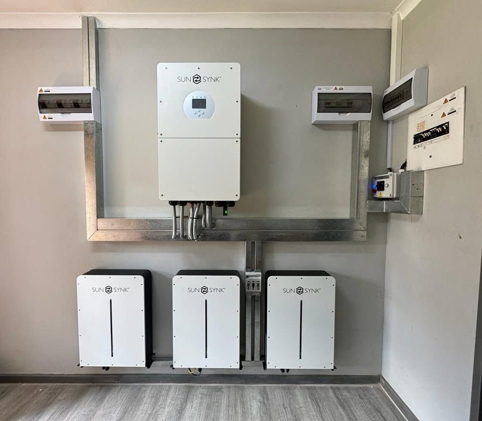 Inverter with three batteries and isolators on a neat galvanised frame